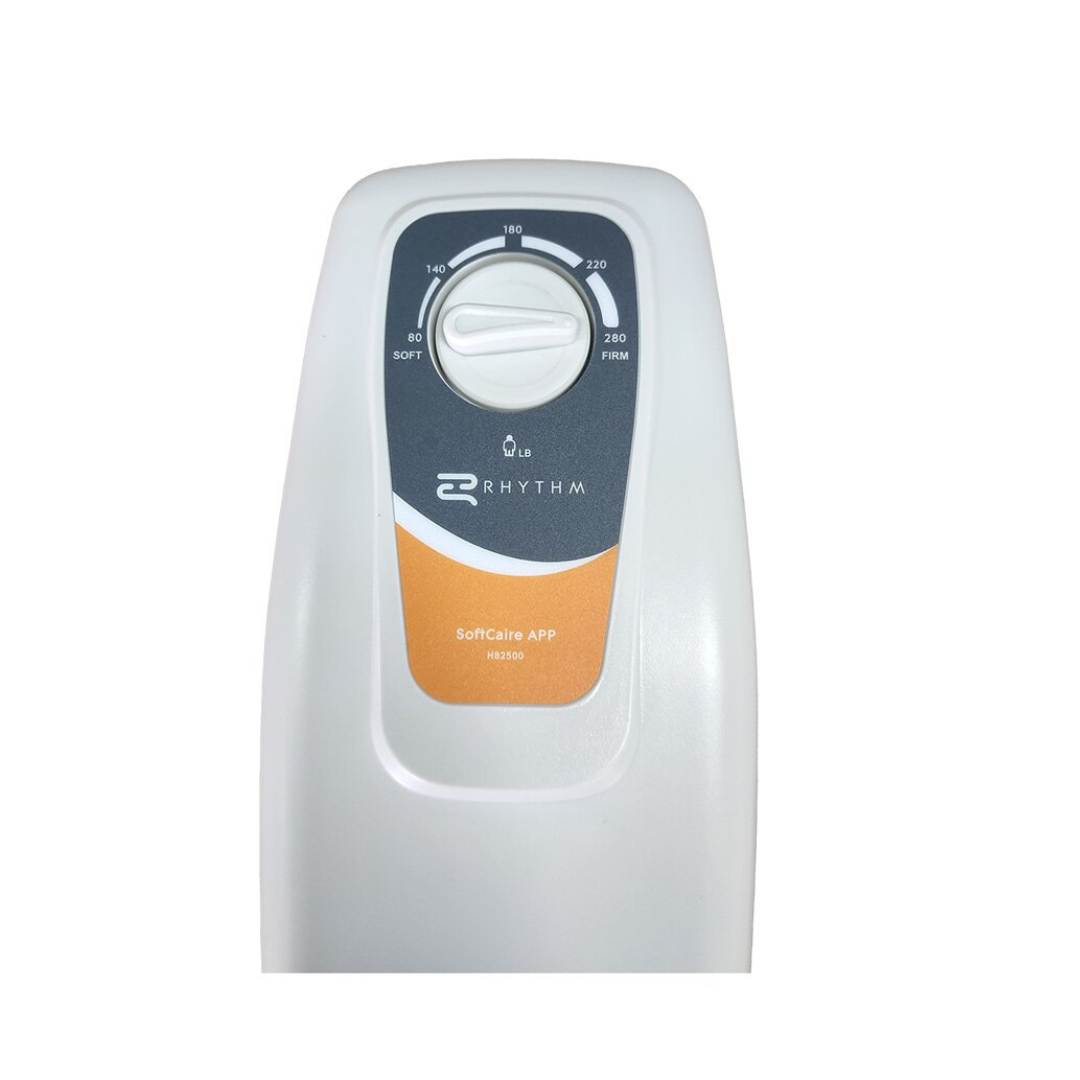 A close-up of the Rhythm SoftCaire Alternating Pressure Pump and Pad with Flaps shows a white device labeled APP H0250, featuring an orange accent, a 0–280 dial, and a gray panel for alternating pressure therapy.