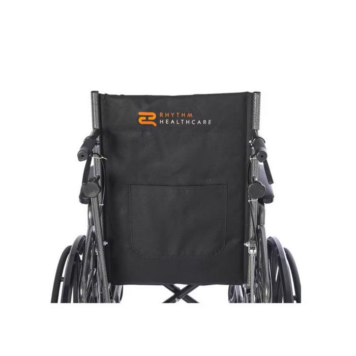 The Rhythm Deluxe Reclining Desk Arm Wheelchair by Rhythm Healthcare features a sleek black design with a back pocket and their distinctive orange and white logo on the backrest. It is equipped with a chrome frame, elevating leg rests, and easily noticeable quick-release rear wheels.