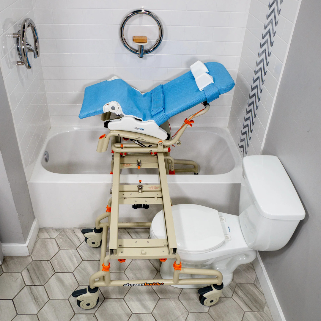 The Rifton Wave Pediatric Shower Chair, in blue and beige with wheels, is placed over a toilet and extends into the bathtub, enabling easy transfers for those with mobility needs.