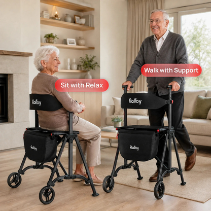 An elderly woman relaxes on a Rolloy Compact Master Bariatric 2-Wheel Walker with Seat, while an elderly man stands using another walker for support in a cozy living room. Labels read "Sit with Relax" and "Walk with Support.