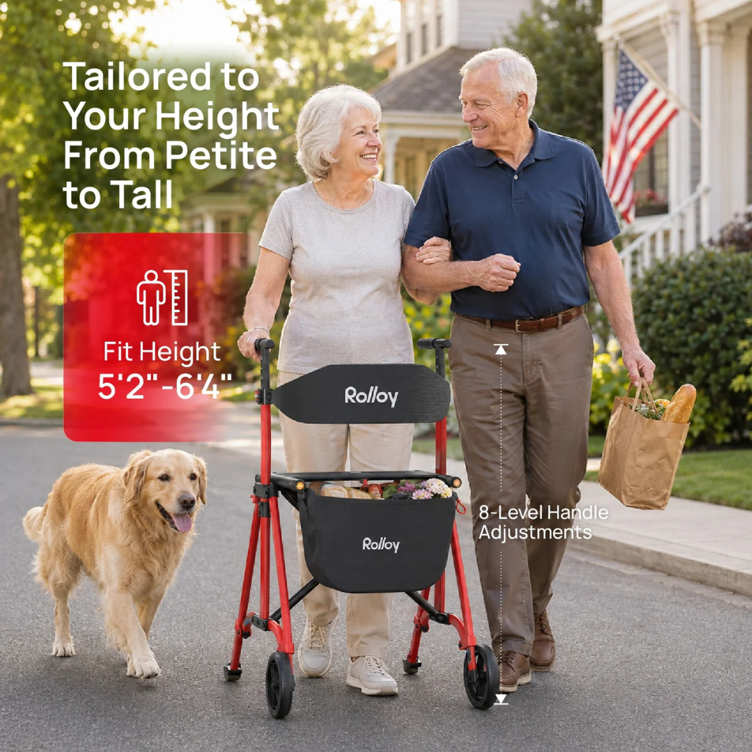 A smiling older woman uses the Rolloy Compact Master Bariatric 2-Wheel Walker with Seat, which features adjustable height and 8 handle levels, as she walks with an older man carrying groceries and a golden retriever on a suburban street.