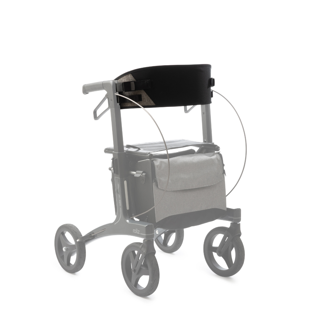 The Padded Backrest For Rollz Air Rollator, shown attached to a gray Rollz Air Rollator with four wheels and a fabric storage bag, features a black cushion with a Velcro strap. The backrest is highlighted while the walker appears semi-transparent.