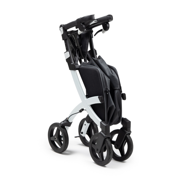 The Rollz FLEX 2 Lightweight Rollator Walker, in black and silver, offers a compact design for easy storage. It has four wheels, a sturdy frame, cushioned handle, and an XL storage bag with seat—ideal for on-the-go parents seeking style and practicality.