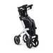 The Rollz FLEX 2 Lightweight Rollator Walker, in black and silver, offers a compact design for easy storage. It has four wheels, a sturdy frame, cushioned handle, and an XL storage bag with seat—ideal for on-the-go parents seeking style and practicality.