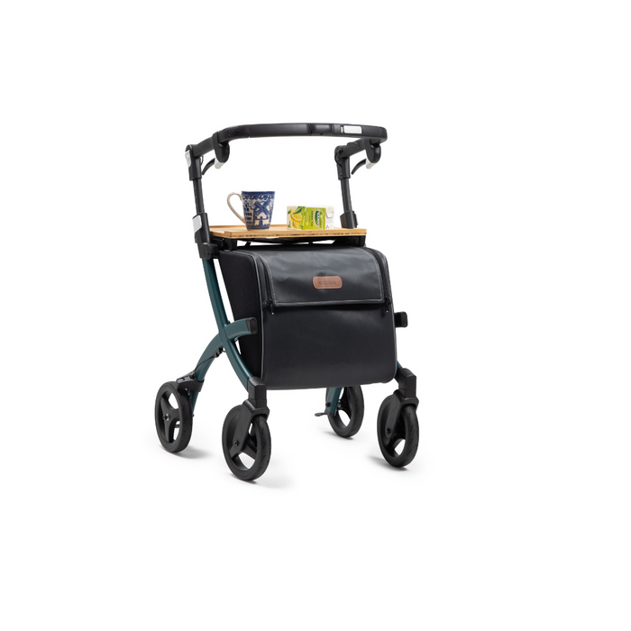 The Rollz FLEX 2 Lightweight Rollator Walker, featuring an XL storage bag and seat, has a compact design holding a tray with a blue-and-white mug, a patterned mug, and an apple.