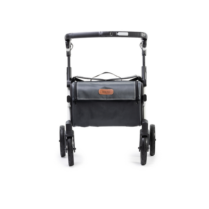 The Rollz FLEX 2 Lightweight Rollator Walker is shown upright on a white background. It features a spacious XL storage bag, top handle, and leather patch label. Its collapsible minimalist frame and four wheels ensure sleek design and easy maneuverability.