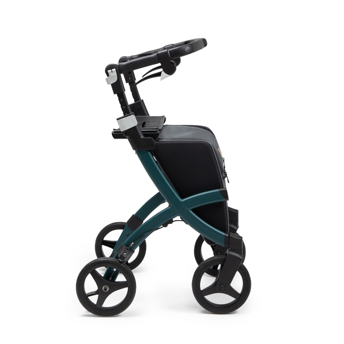 The Rollz FLEX 2 Teal and Black Lightweight Rollator Walker features four wheels, a padded seat, adjustable handles, and an XL storage bag, all in a sleek compact design and shown side profile on a plain white background.