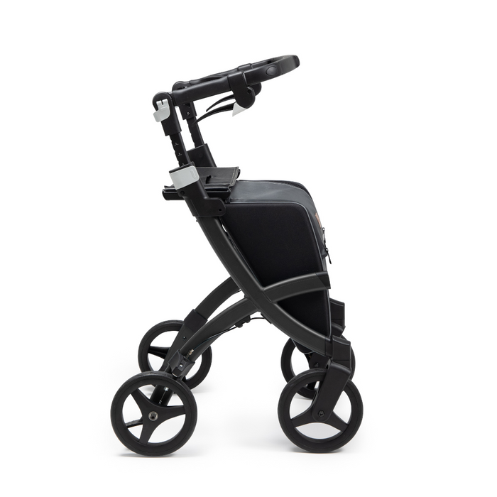 The Rollz FLEX 2 Lightweight Rollator Walker boasts a modern black design with four large wheels and a sturdy frame. It features an XL storage bag, a seat, and is displayed in profile against a white background.