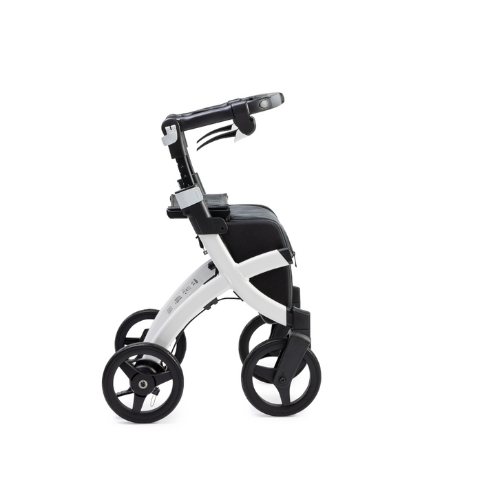 The Rollz FLEX 2 Lightweight Rollator Walker offers a modern white and black design with four wheels, ergonomic handlebars, and a seat with a backrest. Its compact frame includes an XL storage bag, showcasing sleek minimalism in its side-view profile.