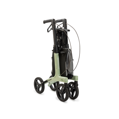 The Rollz Air Lightweight Folding Carbon Rollator, weighing just 10.4 lbs, features a green frame, four large wheels, and a gray storage pouch, shown folded compactly for easy storage and transport.