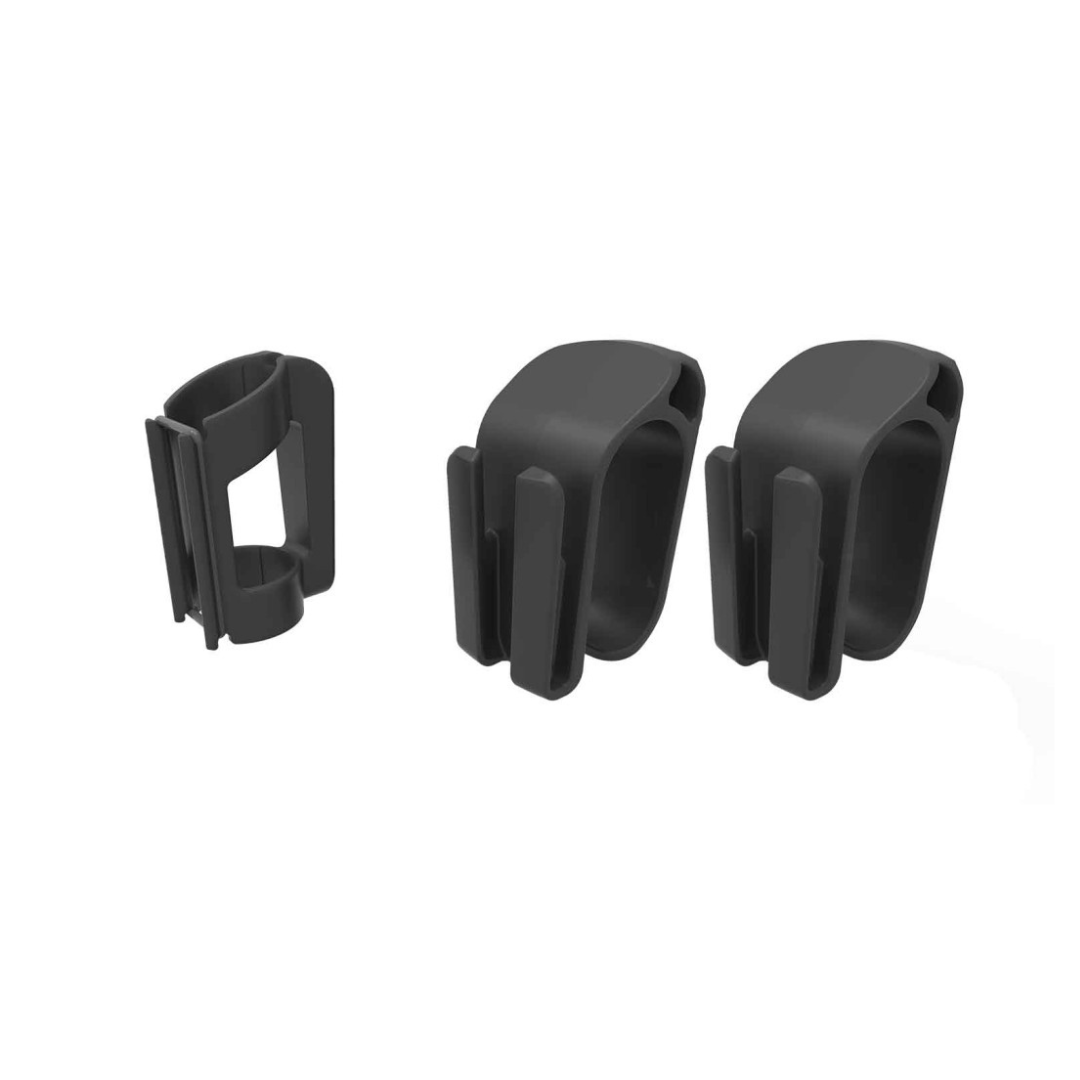 Three Rollz Motion Rollator Accessories in black plastic are displayed: one upright with a clip design for securing cables in a travel or wheelchair package and two lying down with a loop shape and protruding dividers to keep cords tidy.