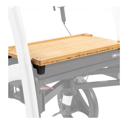 A wooden tray table with a white frame and black accents attaches to the wheelchair leg area, perfectly complementing the Rollz Motion Rollator Accessories for improved mobility.