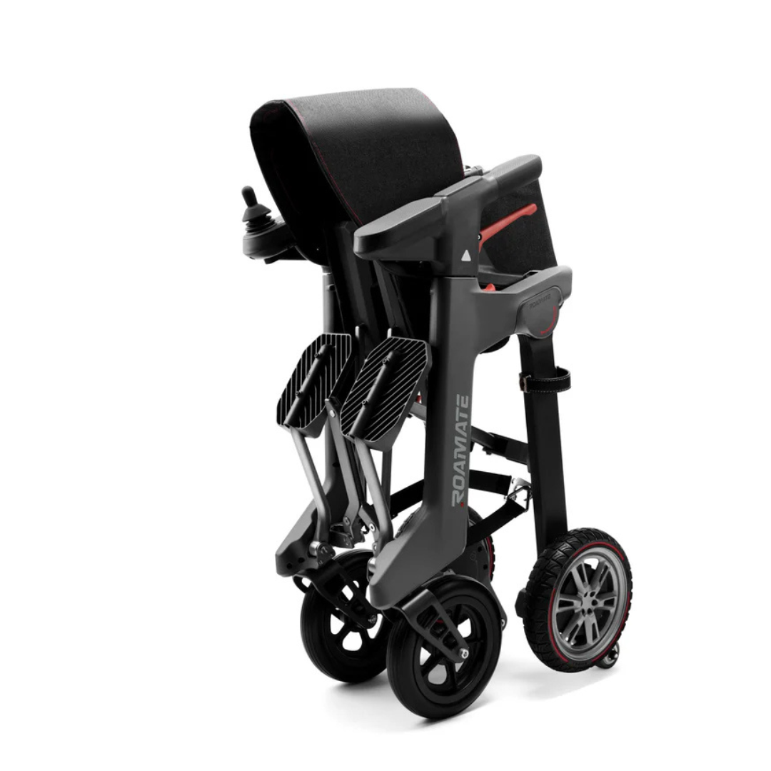 The Roamate 3-in-1 Electric Rollator Wheelchair is a modern, foldable mobility aid with a black and gray frame, joystick armrest control, large rear wheels, and small front wheels—perfect for versatile mobility on the go.