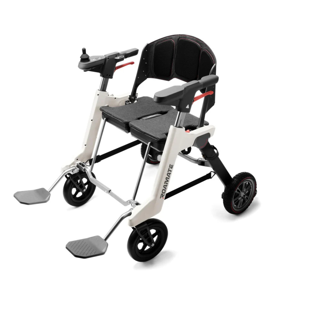 The Roamate 3-in-1 Electric Rollator Wheelchair features a lightweight, foldable black and white frame, padded seat and backrest, armrest joystick control, two large rear wheels, two smaller front wheels, and footrests for versatile mobility.