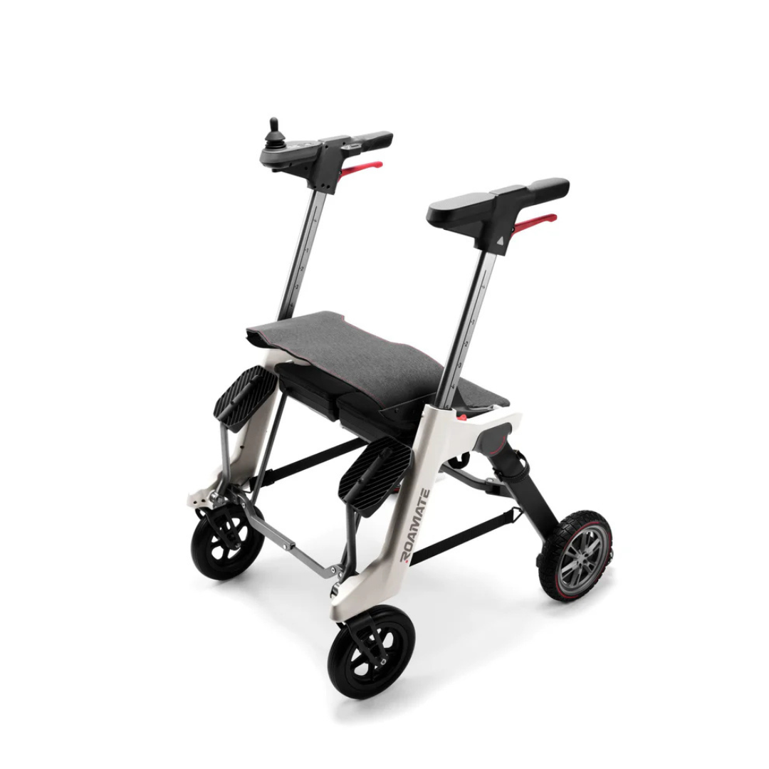 The Roamate 3-in-1 Electric Rollator Wheelchair is a compact, foldable powered device with a seat, armrests, joystick controls, and four wheels in a lightweight black and silver frame for accessible and portable mobility.