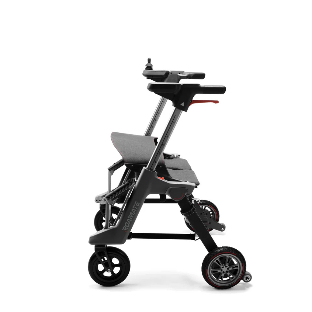 The Roamate 3-in-1 Electric Rollator Wheelchair features a modern, foldable design in black and gray with three large wheels, a compact frame, and versatile mobility options, shown side view against a white background.