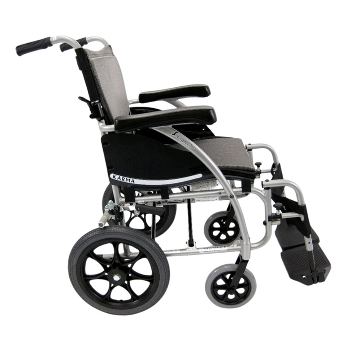 The Karman S-Ergo 115 Ergonomic Ultralite Transport Wheelchair is black and silver, features large rear wheels and smaller front ones, anti-bacterial upholstery, armrests, footrests, and offers a foldable, ultra-lightweight design for easy transport and storage.