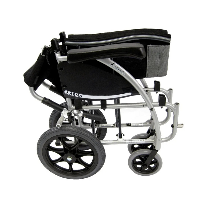 The Karman S-Ergo 115 Ergonomic Ultralite Transport Wheelchair is compact and ultra-lightweight, with a foldable silver frame for easy storage. It features large rear and smaller front wheels, plus anti-bacterial upholstery on the black seat for comfort and hygiene.