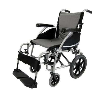 The Karman S-Ergo 115 Ergonomic Ultralite Transport Wheelchair features an ultra-lightweight design with a gray seat and backrest, black armrests, footrests, a silver frame, large rear wheels for easy maneuvering, smaller front wheels, and anti-bacterial upholstery for added hygiene.