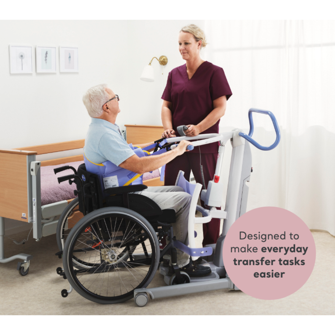 A caregiver in maroon scrubs uses the ARJO Sara Flex Sit-to-Stand Patient Transfer Lift to assist an older man in a wheelchair beside a hospital bed. Text on the image: "Designed to make everyday transfers easier with this caregiver assist device.