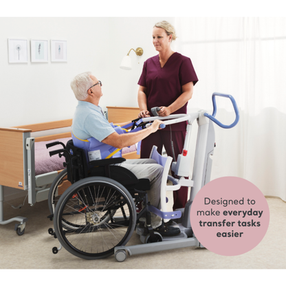 A caregiver in maroon scrubs uses the ARJO Sara Flex Sit-to-Stand Patient Transfer Lift to assist an older man in a wheelchair beside a hospital bed. Text on the image: "Designed to make everyday transfers easier with this caregiver assist device.