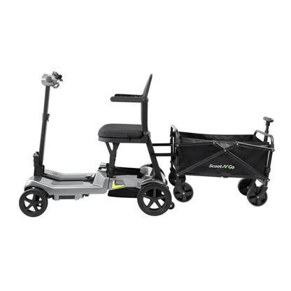 The ScootNGo Lite Portable Folding Scooter is a compact gray scooter with a seat, handlebars, and four wheels. It's attached to a black collapsible wagon with two large wheels and a small handle. See the spec table for full details.