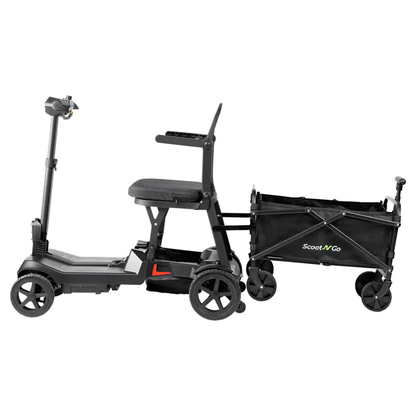 The ScootNGo Lite Portable Folding Scooter, black with four wheels, is shown attached to a compact black collapsible wagon for carrying extra cargo—see full product specs for details.