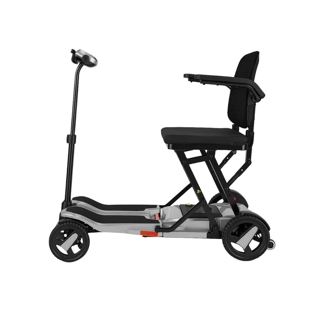Side view of the ScootNgo Voyager Lightweight Folding Scooter—a compact three-wheel mobility scooter with a padded seat, armrests, slim footboard, and upright handlebars, designed for easy personal transportation.