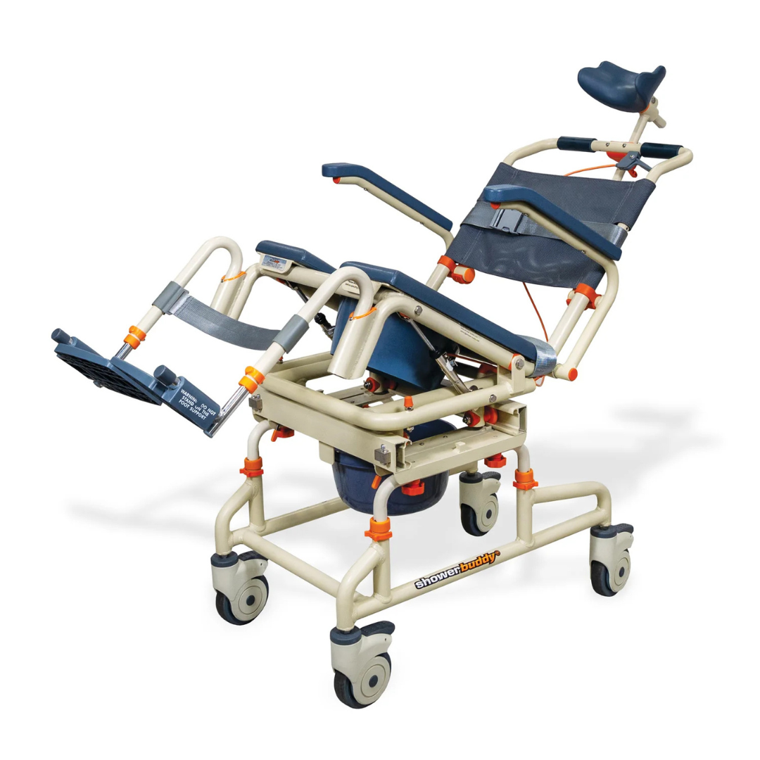 The ShowerBuddy SB2T TubBuddy with Tilt is a beige and blue rolling shower chair with headrest, leg supports, tilt function, and wheels. It includes a detachable bucket beneath the seat for added convenience during accessible bathing.