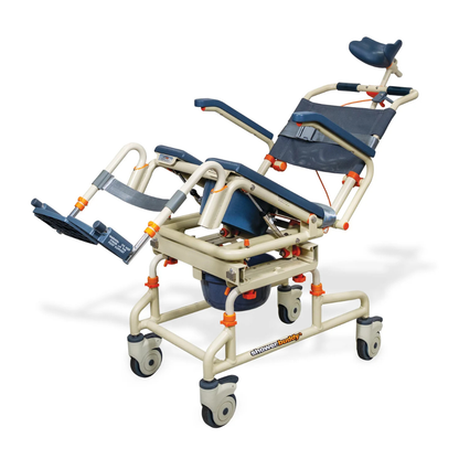 The ShowerBuddy SB2T TubBuddy with Tilt is a beige and blue rolling shower chair with headrest, leg supports, tilt function, and wheels. It includes a detachable bucket beneath the seat for added convenience during accessible bathing.