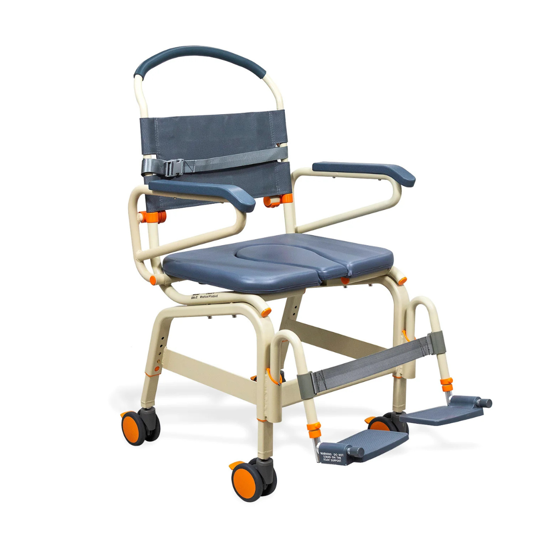 The ShowerBuddy SB6C Bariatric Rolling Shower Chair features a padded seat, armrests, footrests, safety belt, and four orange-wheeled casters for enhanced mobility and accessible patient care.