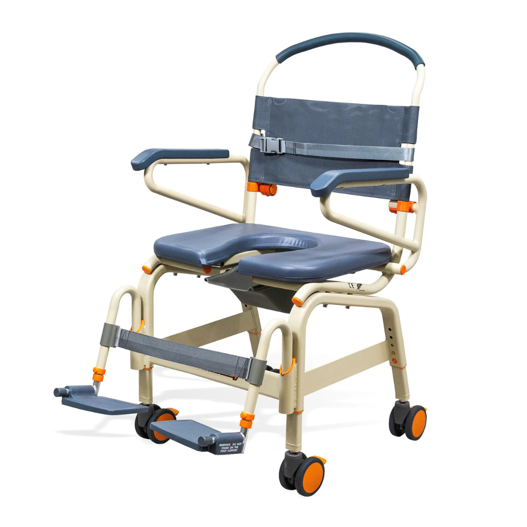 The ShowerBuddy SB6C Bariatric Rolling Shower Chair is a lightweight, portable shower and commode chair with padded seat/backrest, armrests, foldable footrests, and four orange-accented wheels for easy mobility and support in any roll-in shower.