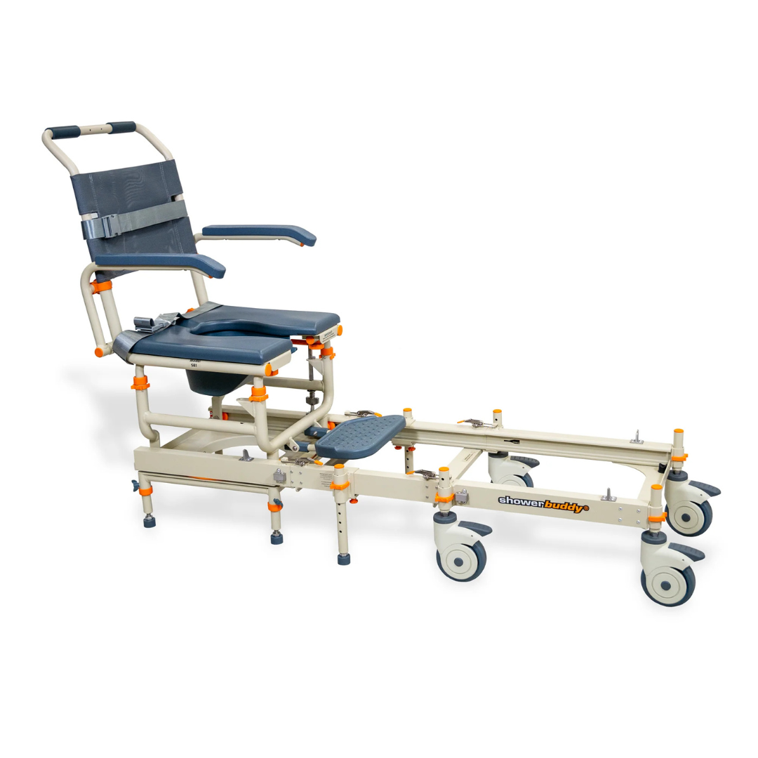 The ShowerBuddy® SB1 Transfer System with Rolling Shower Chair features a blue padded seat and backrest, safety straps, armrests, footrest, and a beige metal frame on wheels for easy patient transfer and bathing assistance.