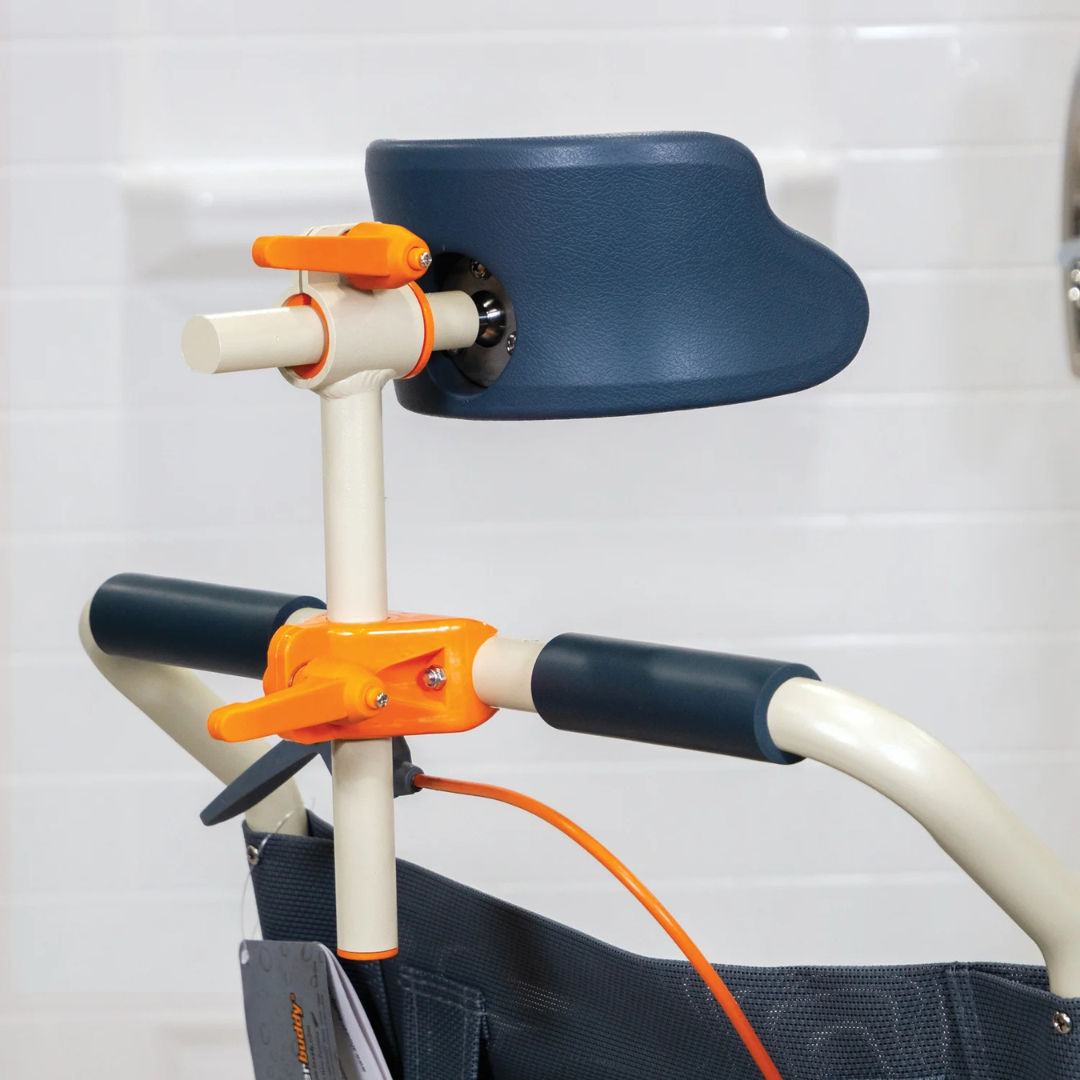 Close-up of the ShowerBuddy SB3T Roll-In Shower Chair with Tilt Recline, featuring padded blue arm supports and orange adjustment knobs for comfort and stability, set against a white tiled background.