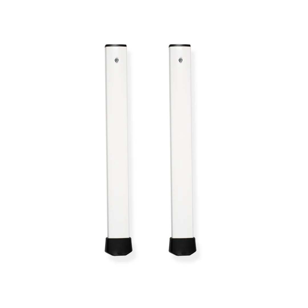 Two upright, rectangular, white metal table legs with black end caps are shown side by side against a white background as accessories and parts for ShowerGlyde® Transfer Benches, designed for lasting support and bathing comfort.