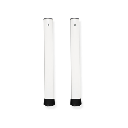 Two upright, rectangular, white metal table legs with black end caps are shown side by side against a white background as accessories and parts for ShowerGlyde® Transfer Benches, designed for lasting support and bathing comfort.