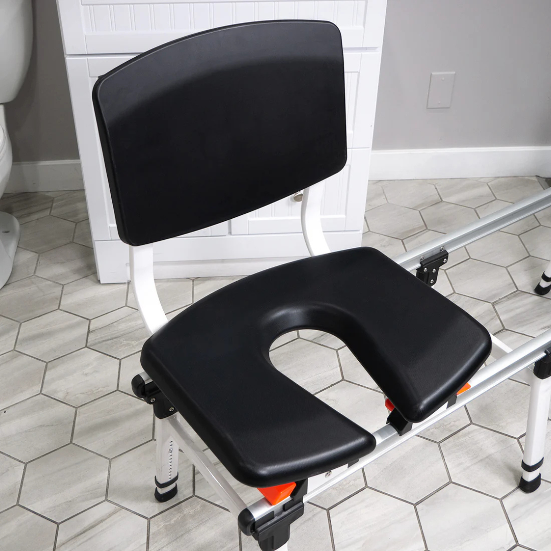 The Accessories and Parts for ShowerGlyde® Transfer Benches feature a durable, hard-plastic U-shaped seat, high backrest, and metal legs—ideal for comfortable, secure bathing in your tiled bathroom.
