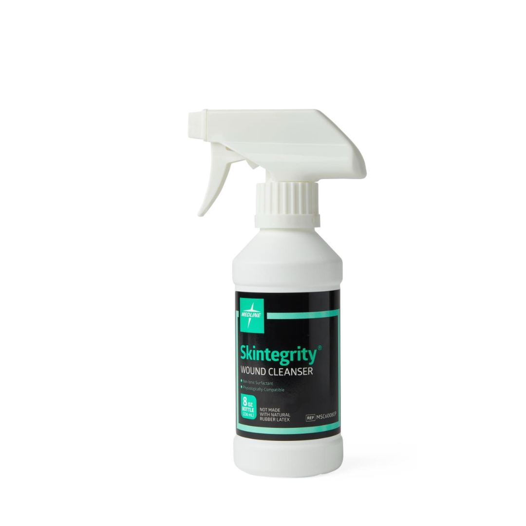 A white spray bottle labeled Medline Skintegrity Wound Cleansers, featuring a green and black design with a trigger nozzle, stands upright on a plain white background—ideal for effective wound care.