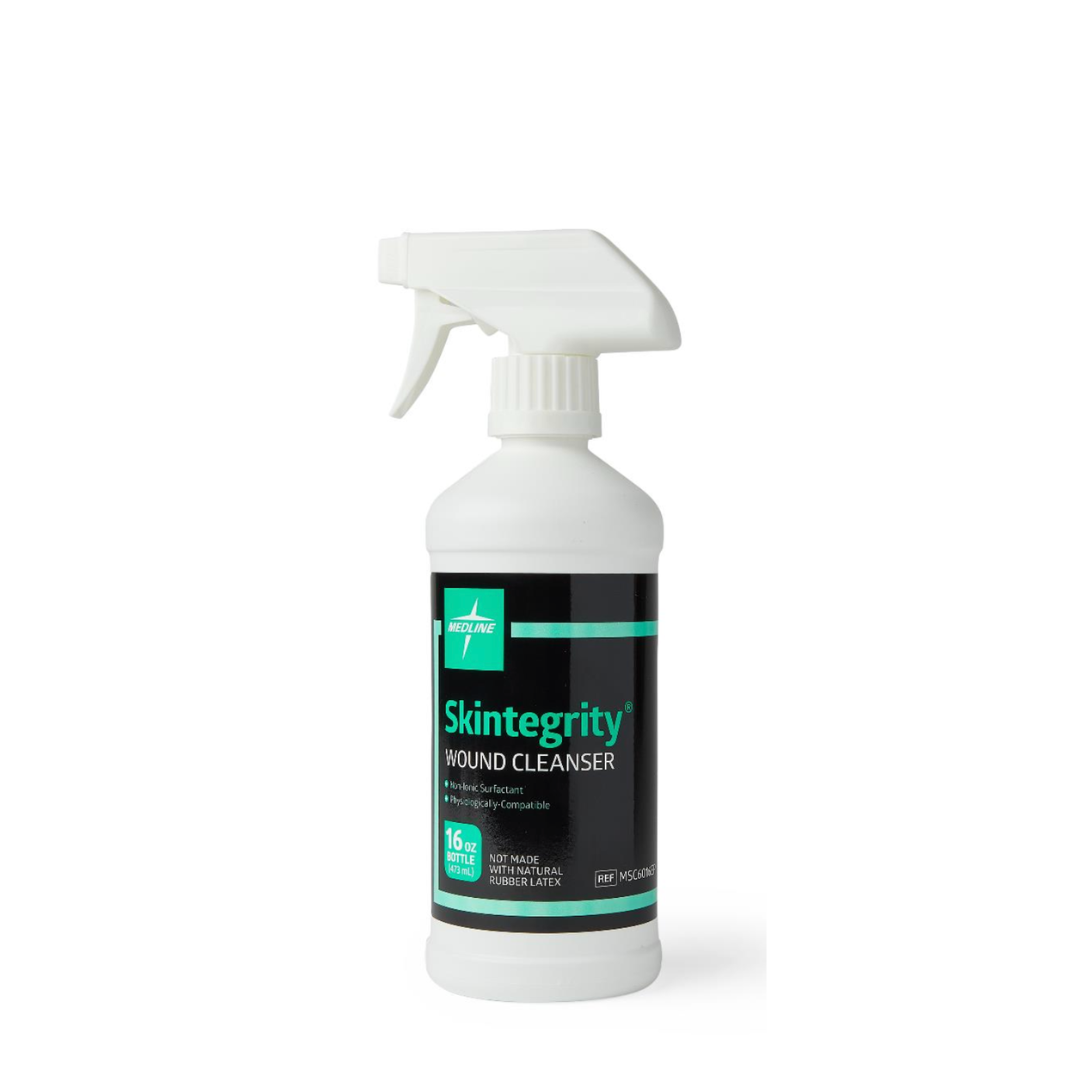 A white spray bottle labeled Medline Skintegrity Wound Cleansers, with a green cross logo and sleek design. This 16 oz (473 mL) solution offers effective wound care as part of the trusted Medline Skintegrity line.