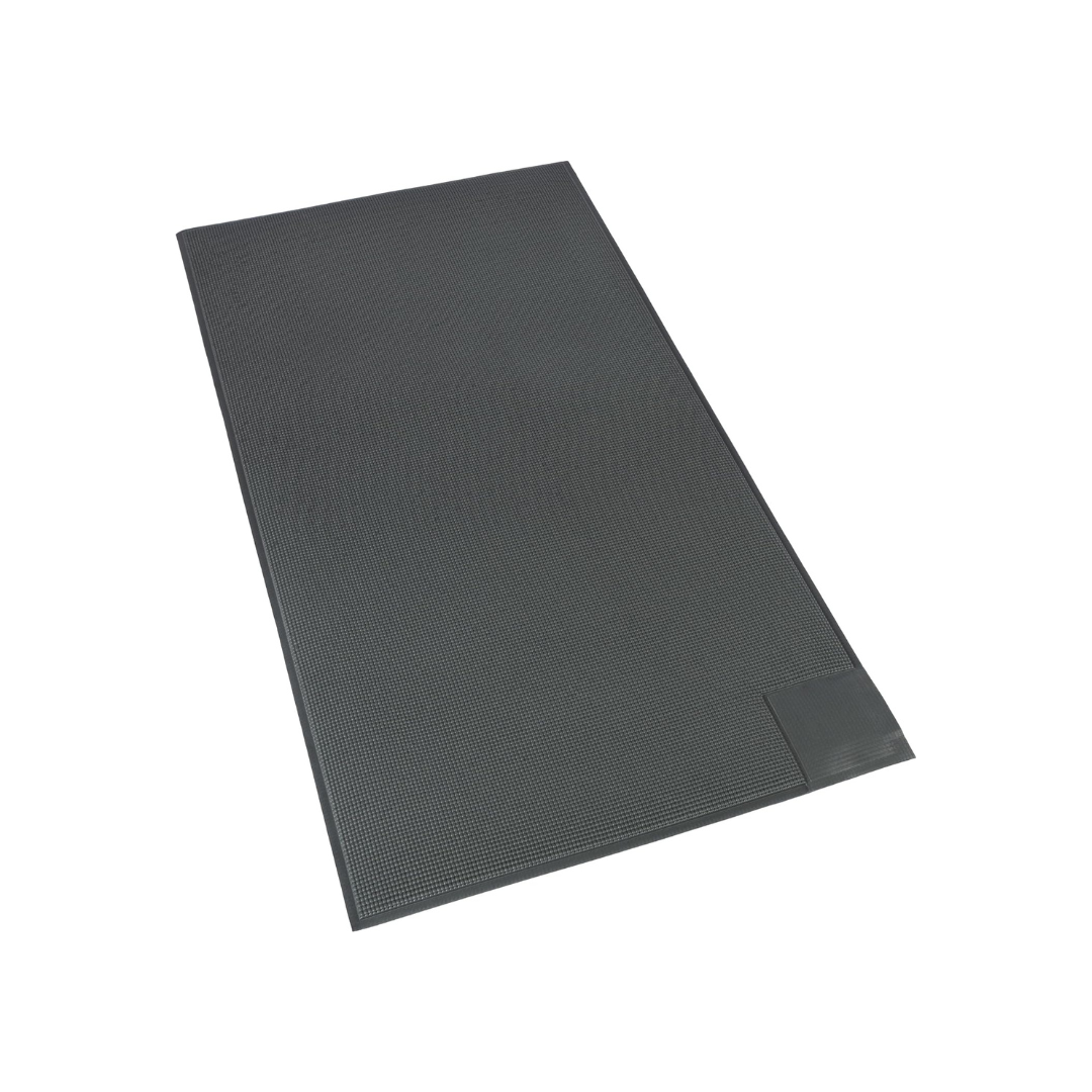 A rectangular, textured black mat with slightly raised edges and a small, smooth rectangular patch in one corner—designed for use with the SmartCaregiver Pager Bed/Chair Exit Alert & Systems—is shown on a white background.