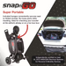 A compact black Glion SnapnGO Ultralight Folding Mobility Scooter with three speeds is folded in a car trunk, secured by a bungee cord, highlighting its travel-friendly portability and airline-approved safety certification.