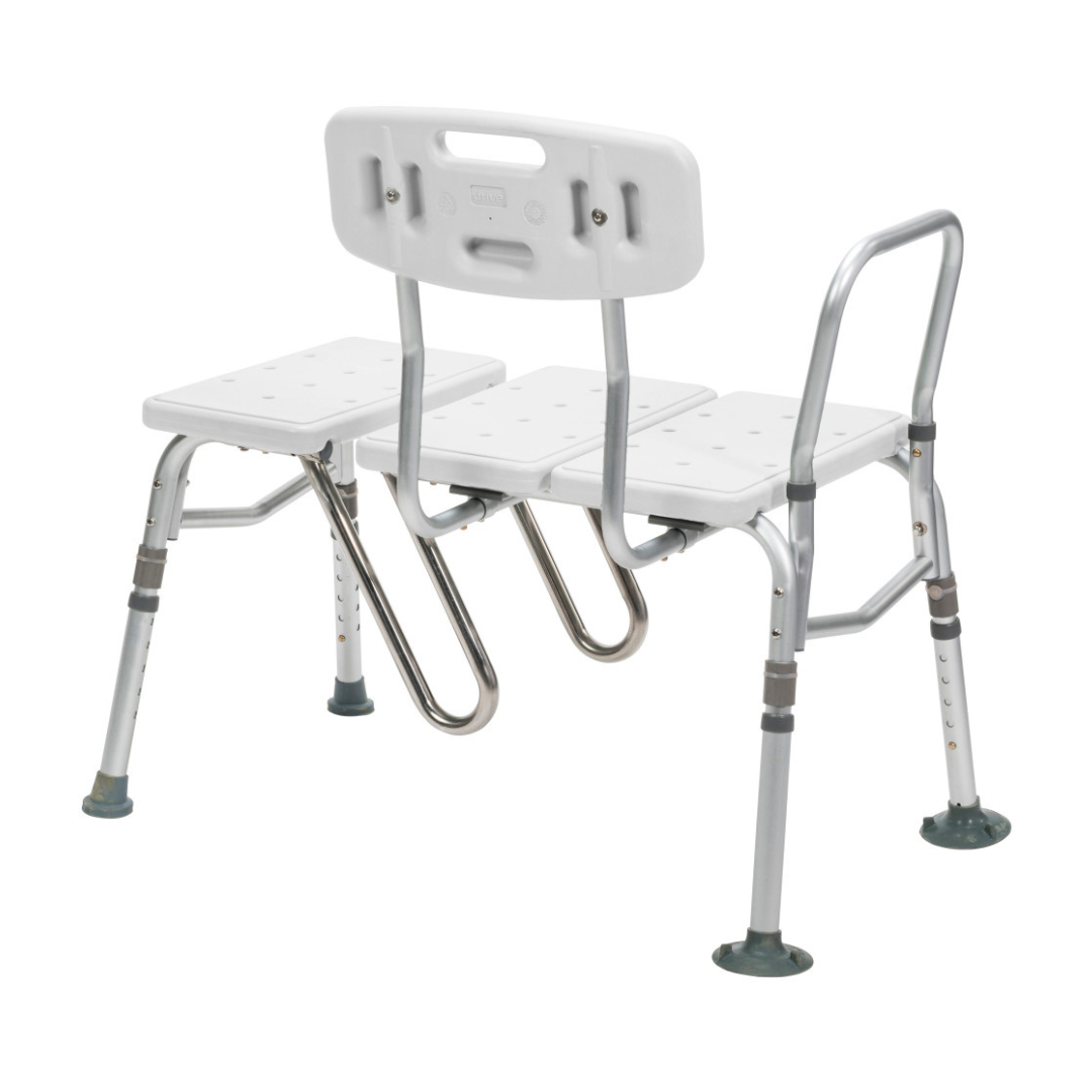The Drive Splash Defense™ Transfer Bench with Curtain Guard Protection features a white and silver adjustable design, backrest, armrest, drainage seat holes, and non-slip rubber feet—ideal for seniors seeking safe, comfortable bathing.