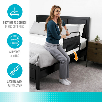 A woman uses the Stander Safety Bed Rail & Padded Pouch (30" rail) with a standing handle to sit on her bed. Infographics show it supports up to 300 lbs, offers fall protection, and secures with a safety strap for peace of mind.