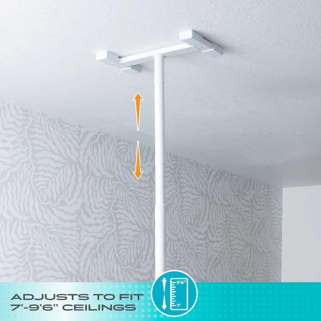 The Stander Double Handle Floor to Ceiling Grab Bar, shown in white and mounted on a patterned ceiling, features orange arrows for vertical adjustment and fits ceilings 7’–9’6” high.
