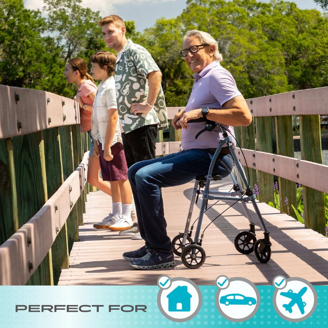 An older man uses the Stander Space Saver Rollator - Ultra Compact & Lightweight on a wooden bridge with three others, all gazing at the water on a sunny day. Icons below indicate it's ideal for home, car, and airplane use.