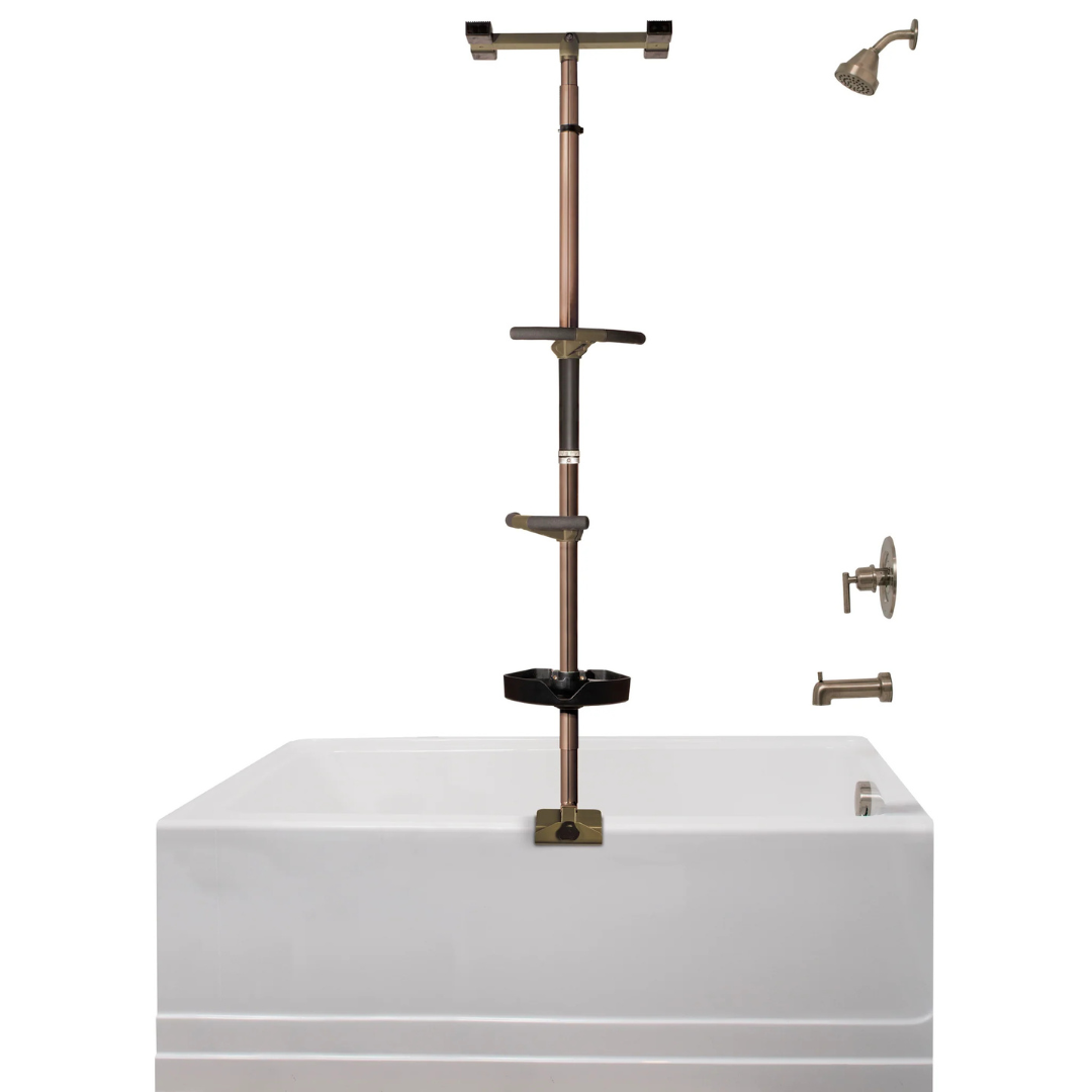 The Stander Wonder Premium Bathtub Fall Prevention Pole in bronze, featuring adjustable shelves, is installed in the corner of a white bathtub for stability and safety, with coordinating showerhead and faucet fixtures on the wall.