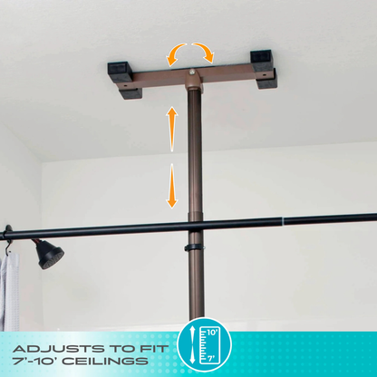 The Stander Wonder Premium Bathtub Fall Prevention Pole with ceiling mounts and adjustment arrows is installed between floor and ceiling near a bathtub and shower curtain rod. Text below reads, ADJUSTS TO FIT 7-10’ CEILINGS with a measuring icon.
