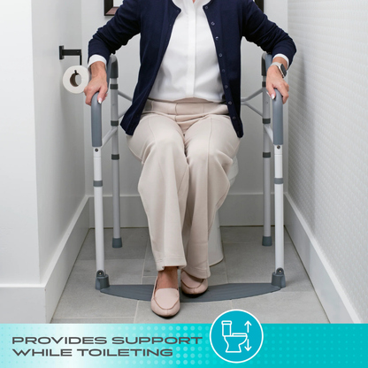 An older adult uses the Stander Wonder Toilet Safety Rails & Standing Aid with armrests for bathroom support. Text at the bottom reads, Provides stability while toileting, with a toilet icon.