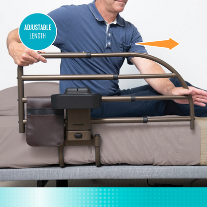 A man demonstrates the Signature Life Freedom Click Extendable Bed Rail attached to a bed, showing its rail extending or retracting for fall protection. The rail has a pouch, tray, and a label reading "ADJUSTABLE LENGTH" with an arrow indicating adjustability.