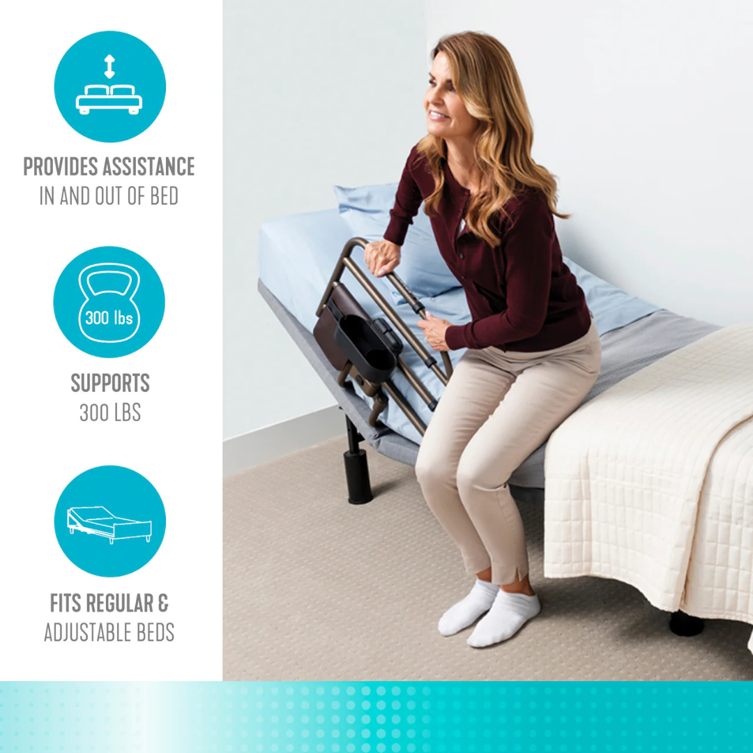 A woman uses the Signature Life Freedom Click Extendable Bed Rail to sit up from an adjustable bed. The rail offers fall protection, supports up to 300 lbs, and fits both standard and adjustable beds.